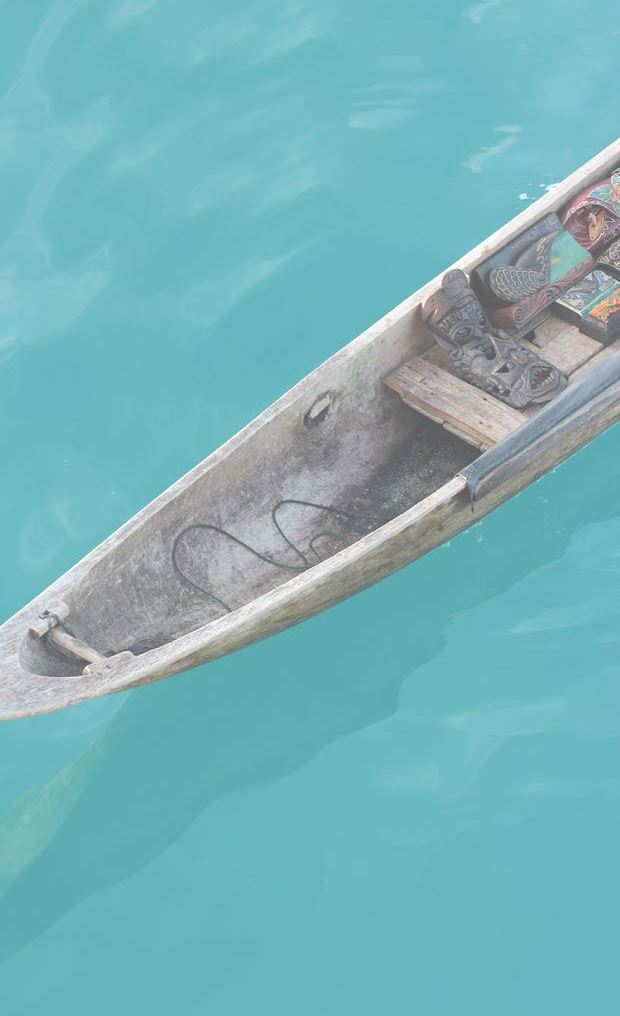 Picture of dougout canoe floating in clear water